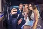 3 prom attendees taking a selfie in style