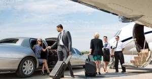 A group of business people boarding a private jet at Trenton airport.