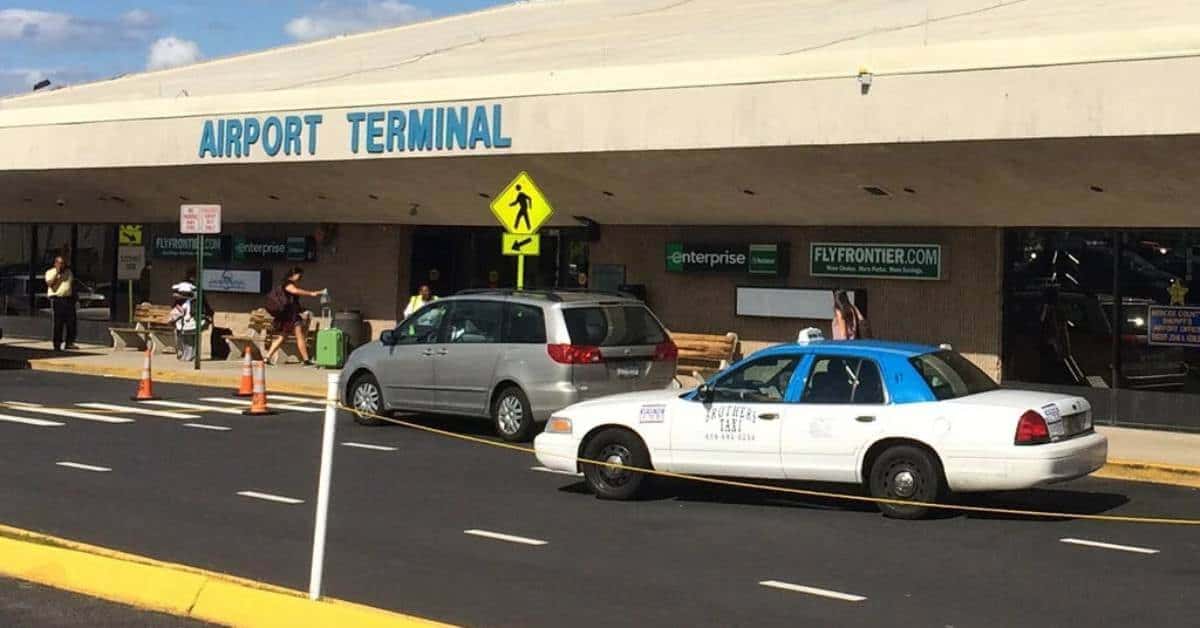 A police car is parked in front of Trenton airport terminal.